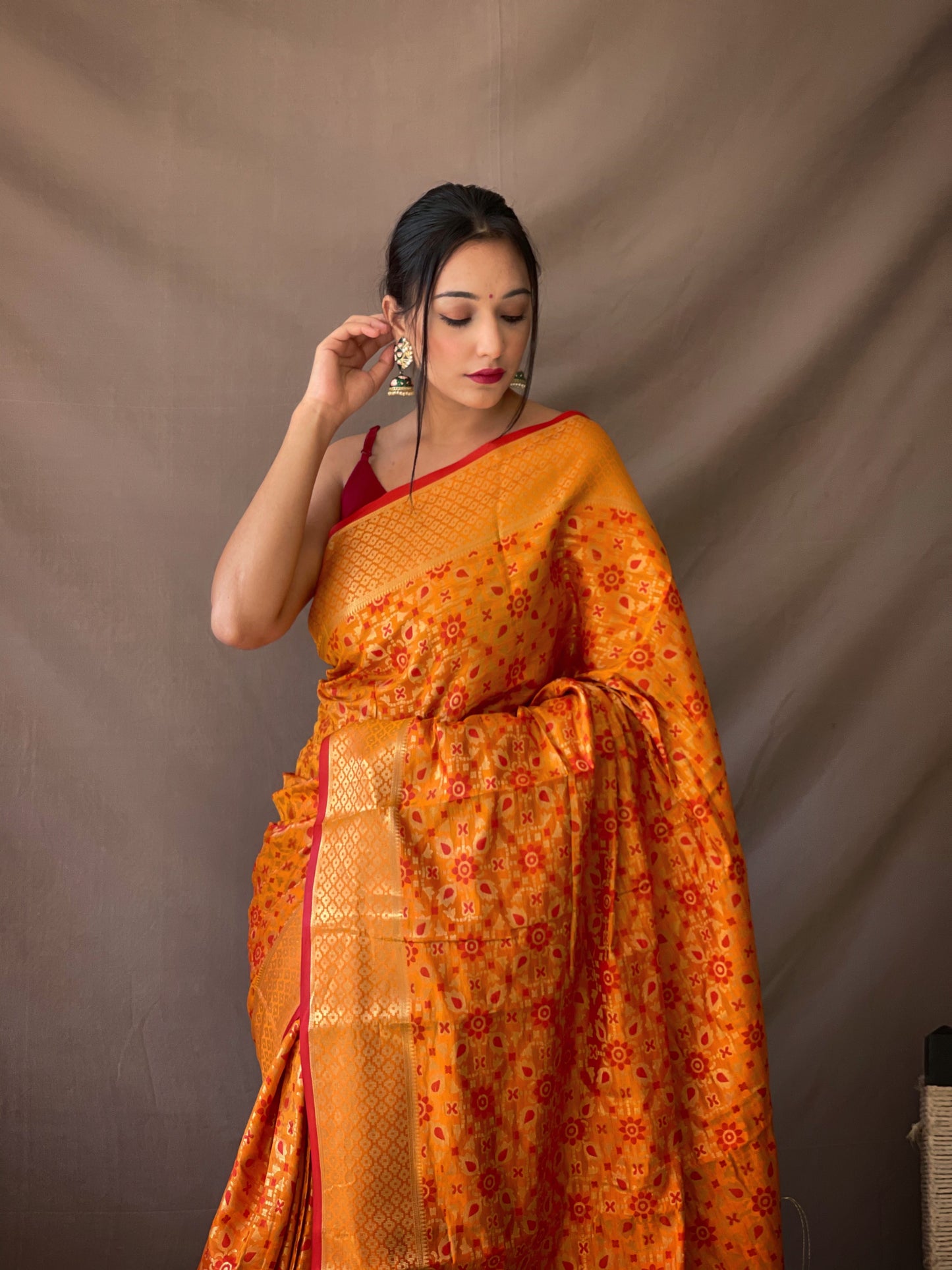 Orange Gold Zari And Meenakari Patola Sarees