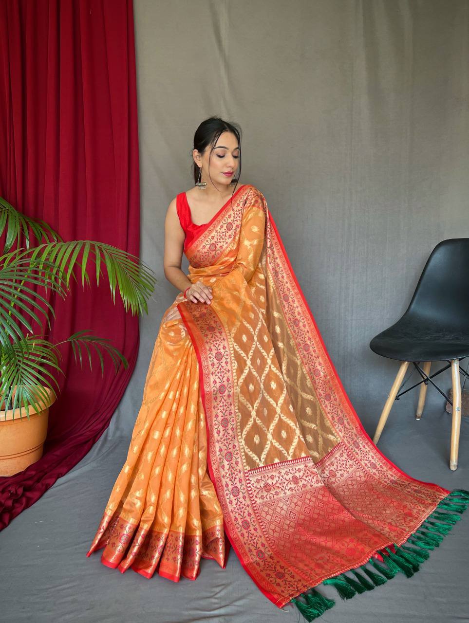 Orange Pure organza weaved saree with Jacquard border.