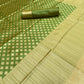 Bottle Green Silk Saree With Zari Weaving Work.