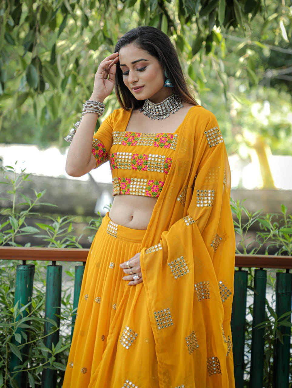 Mustered  Embroidered Faux Georgette Party Wear Lehenga Choli